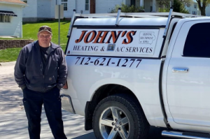 John standing next to truck